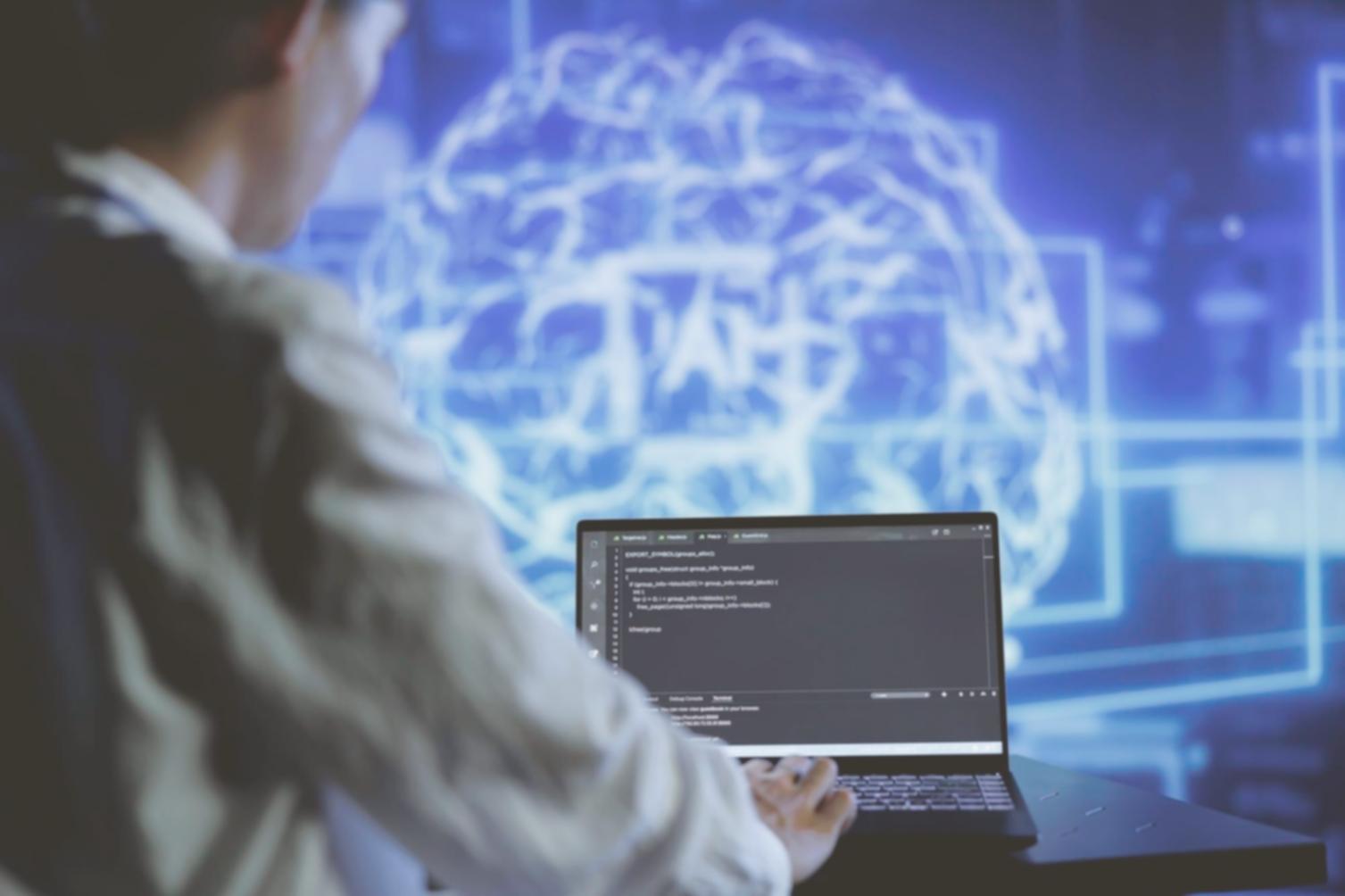 UI designer working on interface prototypes with multiple screens
